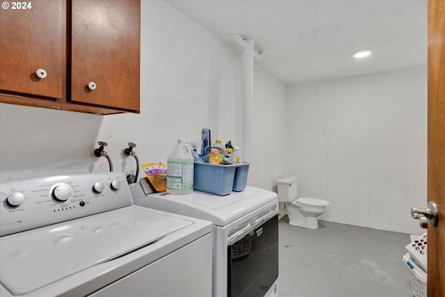 clothes washing area featuring independent washer and dryer