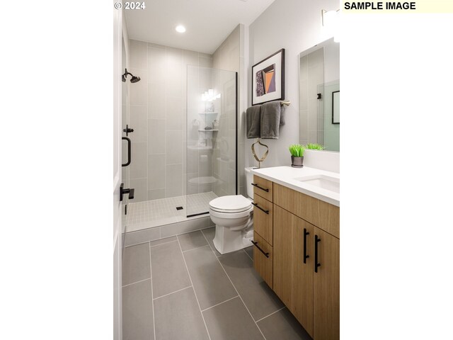 3603 N 12th Cir, Ridgefield, WA 98642 - full bathroom with tile patterned flooring, a stall shower, toilet, vanity, and recessed lighting
