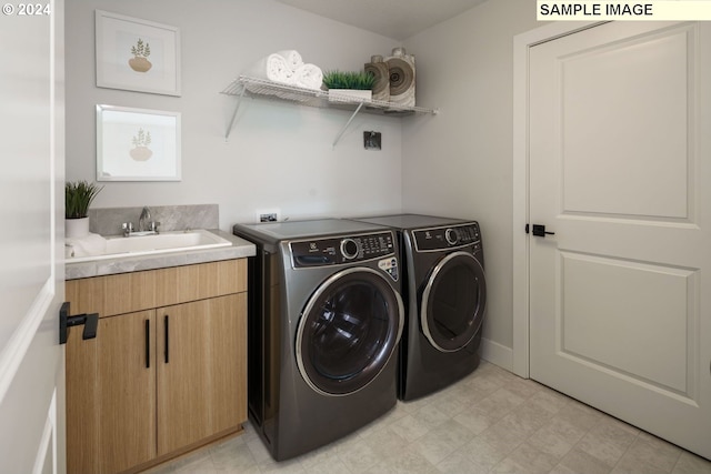 3603 N 12th Cir, Ridgefield, WA 98642 - laundry area featuring washing machine and clothes dryer, cabinet space, and light floors