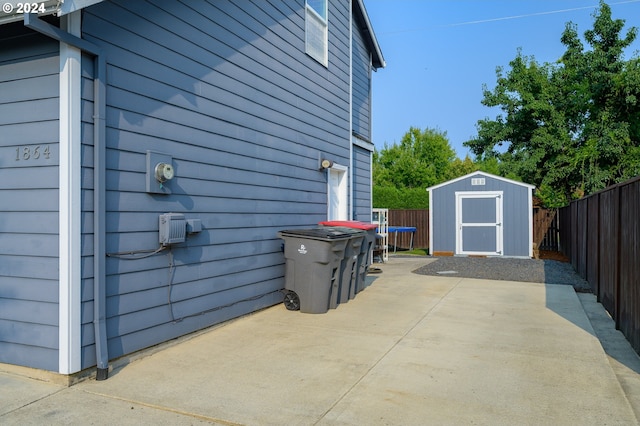 view of patio / terrace featuring a storage unit