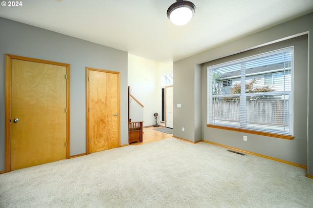 unfurnished bedroom featuring carpet