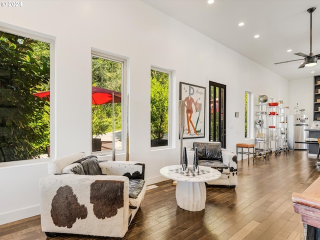 living area featuring recessed lighting, baseboards, ceiling fan, and hardwood / wood-style flooring