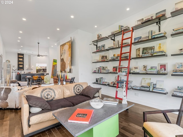 living area with recessed lighting, dark wood-type flooring, and ceiling fan