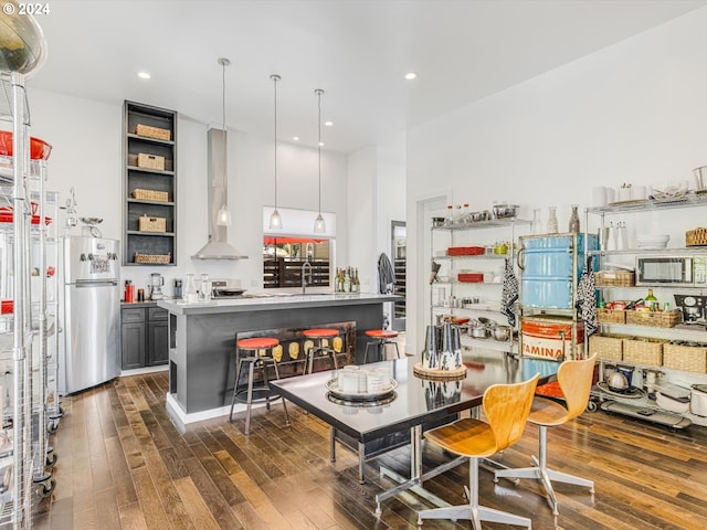 dining space with recessed lighting and wood-type flooring