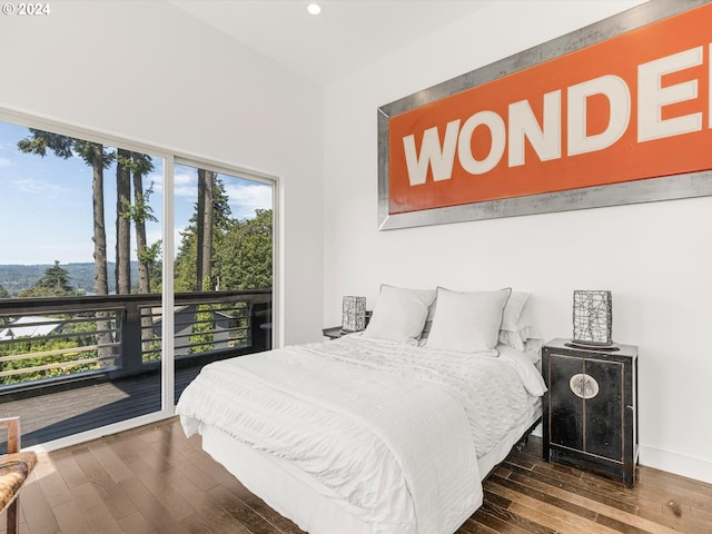 bedroom with recessed lighting, baseboards, wood finished floors, and access to exterior