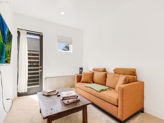 living area with recessed lighting, baseboards, and light carpet