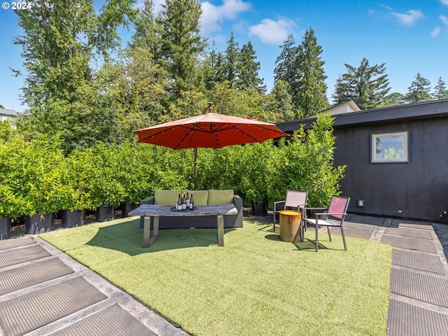 view of yard with outdoor lounge area and a patio area