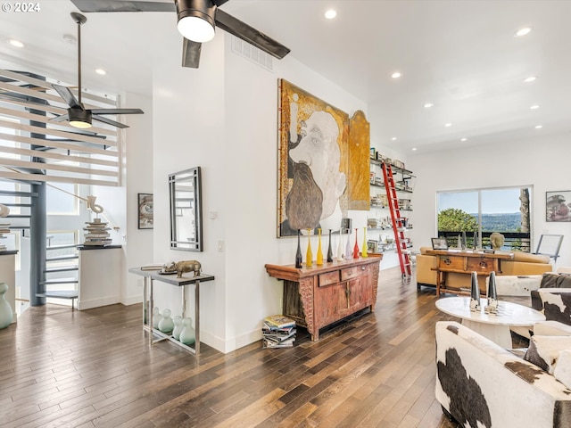 living room featuring a ceiling fan, hardwood / wood-style flooring, recessed lighting, stairway, and baseboards