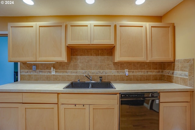 kitchen with sink, black dishwasher, decorative backsplash, and light brown cabinets