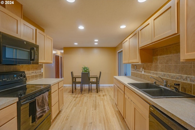 kitchen featuring light hardwood / wood-style flooring, sink, black appliances, backsplash, and light brown cabinets