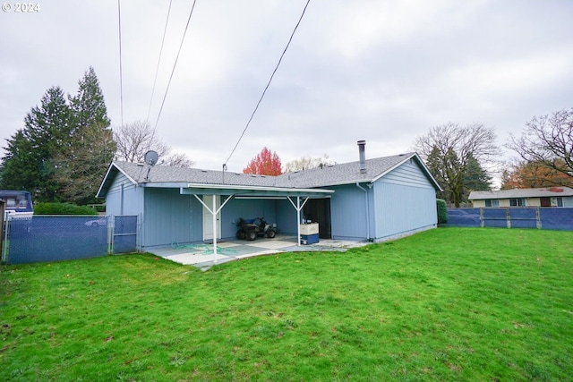 back of property featuring a patio and a lawn