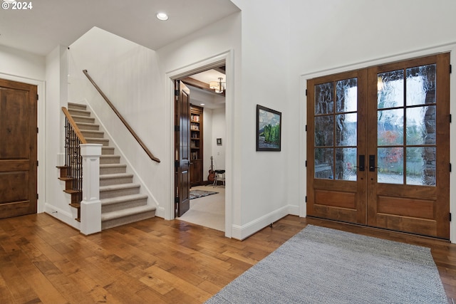 foyer with french doors and hardwood / wood-style flooring