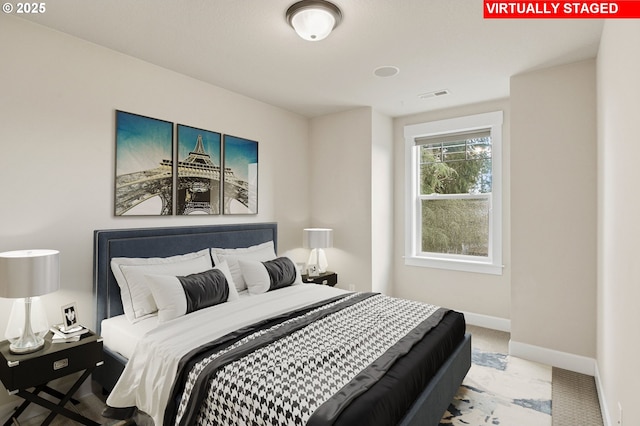 bedroom featuring carpet, visible vents, and baseboards