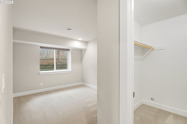 interior space with carpet floors and baseboards