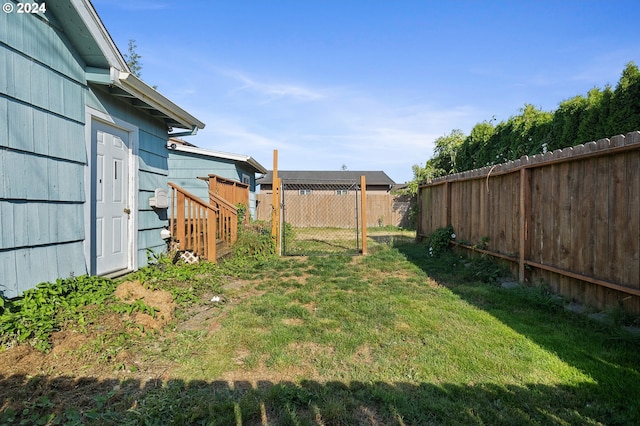 view of yard with a fenced backyard