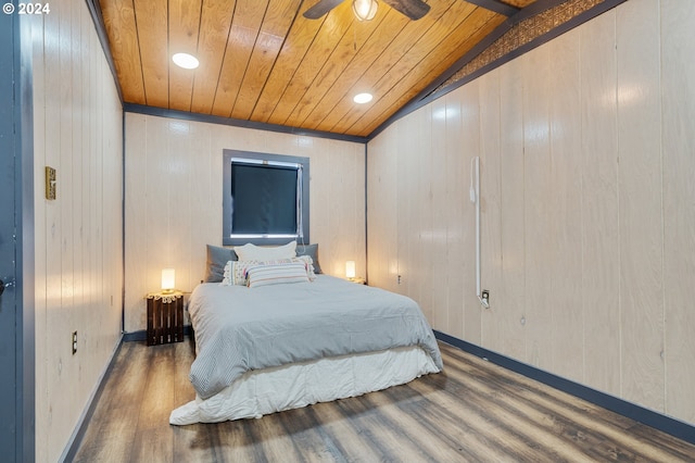 bedroom featuring hardwood / wood-style floors, wooden ceiling, and vaulted ceiling