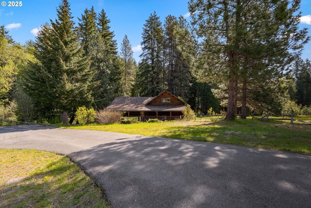 96 Mount Adams Rd, Trout Lake, WA 98650 - view of front of home with a wooded view and a front yard