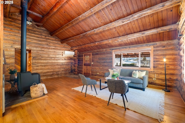 unfurnished living room with wooden ceiling, hardwood / wood-style floors, a wood stove, and log walls