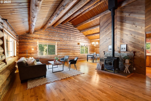 96 Mount Adams Rd, Trout Lake, WA 98650 - living room with a wood stove, wooden ceiling, rustic walls, and wood finished floors