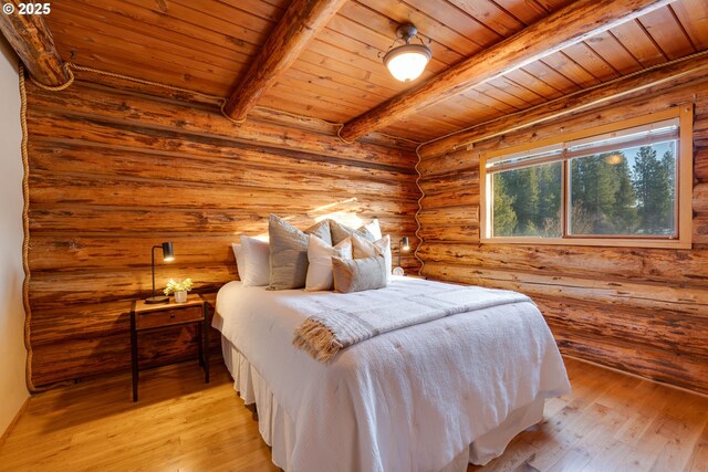 96 Mount Adams Rd, Trout Lake, WA 98650 - bedroom featuring a wooden ceiling with exposed beams, rustic walls, and light wood-type flooring