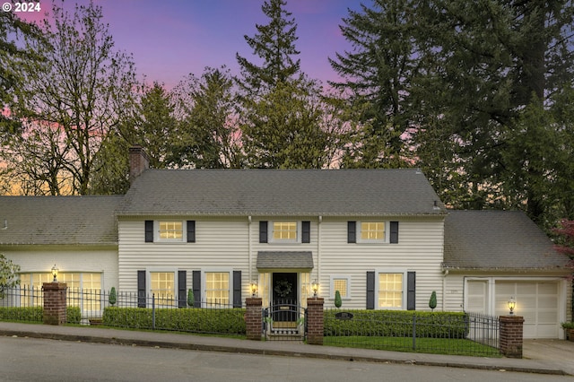 colonial inspired home with a garage