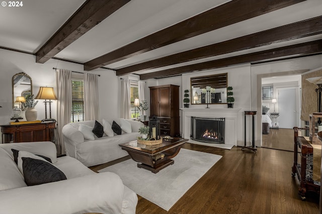 living room with beamed ceiling and dark hardwood / wood-style floors