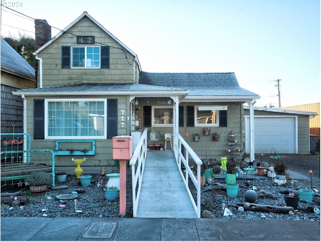 view of front facade with a chimney, a garage, and roof with shingles