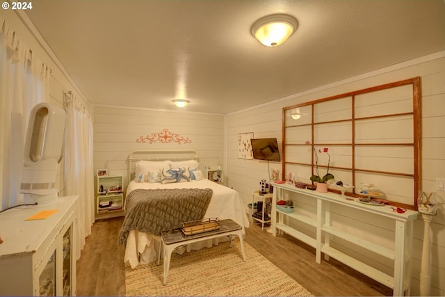 bedroom with wood finished floors