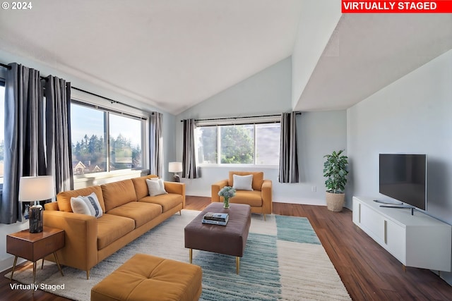 living room featuring hardwood / wood-style floors and vaulted ceiling