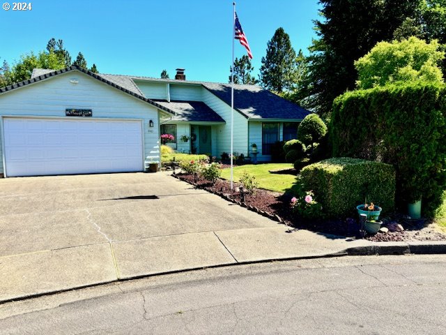 ranch-style house featuring a garage