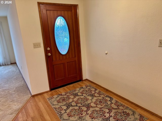 foyer entrance featuring light hardwood / wood-style flooring