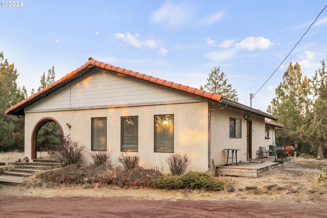 view of side of home featuring stucco siding