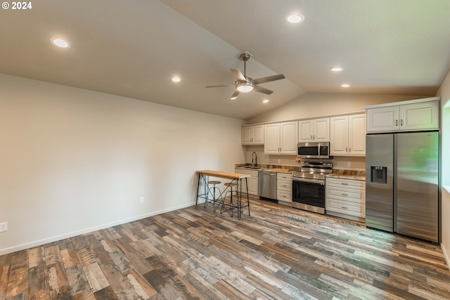 kitchen with dark hardwood / wood-style flooring, lofted ceiling, ceiling fan, white cabinets, and appliances with stainless steel finishes