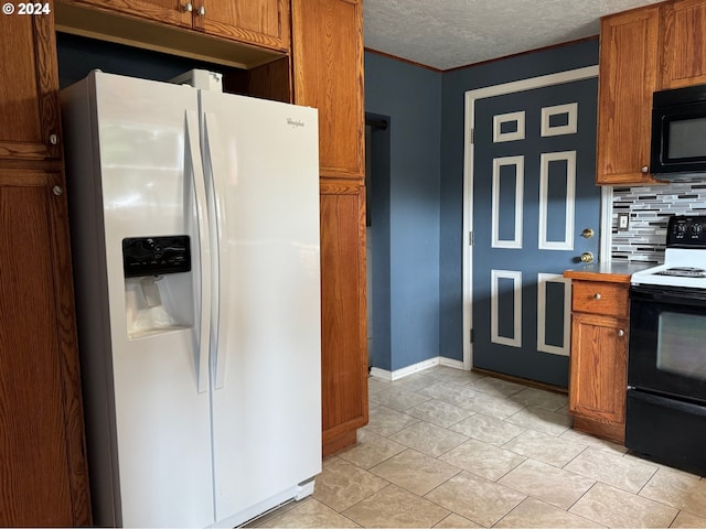 kitchen featuring a textured ceiling, black appliances, backsplash, light tile patterned floors, and crown molding