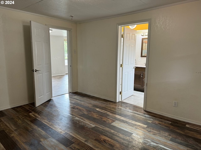 spare room featuring dark hardwood / wood-style flooring