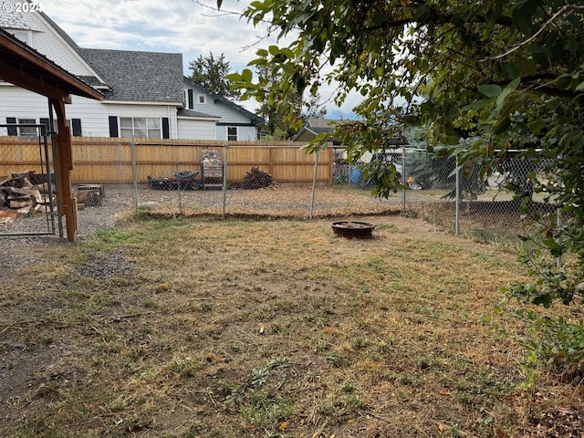 view of yard with an outdoor fire pit