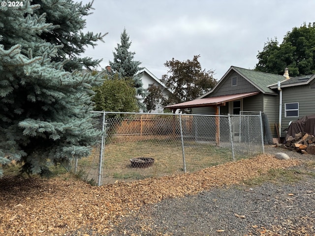 view of yard with an outdoor fire pit