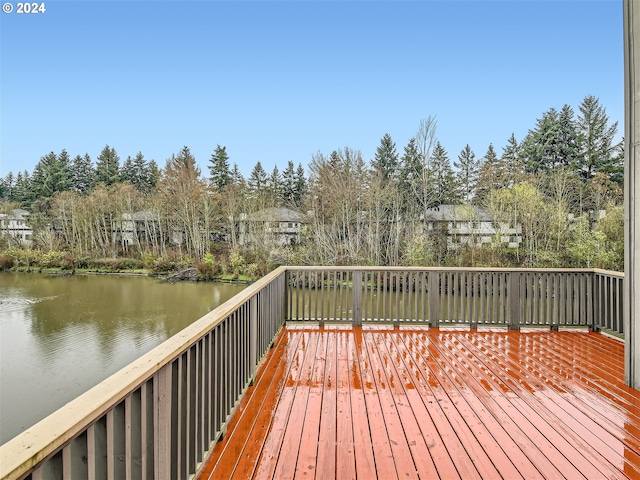 wooden deck featuring a water view