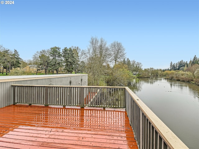 deck featuring a water view