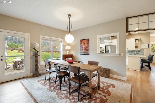 dining area with light wood-type flooring