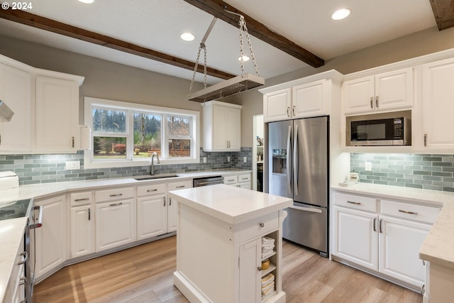 kitchen with white cabinetry, sink, beamed ceiling, backsplash, and appliances with stainless steel finishes