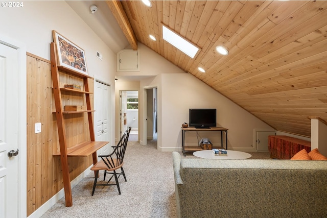 carpeted home office with vaulted ceiling with skylight and wood ceiling