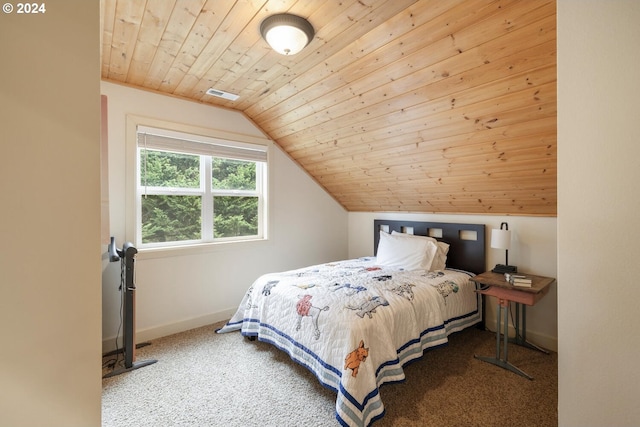 bedroom featuring carpet flooring, wooden ceiling, and vaulted ceiling