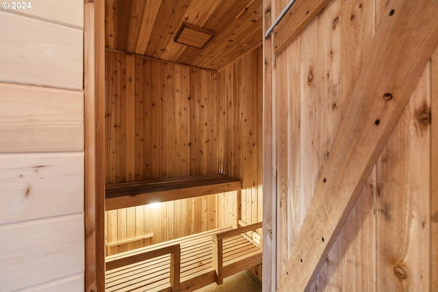 interior details featuring wooden walls and wood ceiling