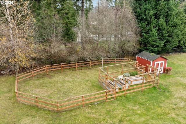 view of yard featuring a rural view and an outdoor structure