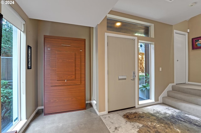 view of carpeted entrance foyer