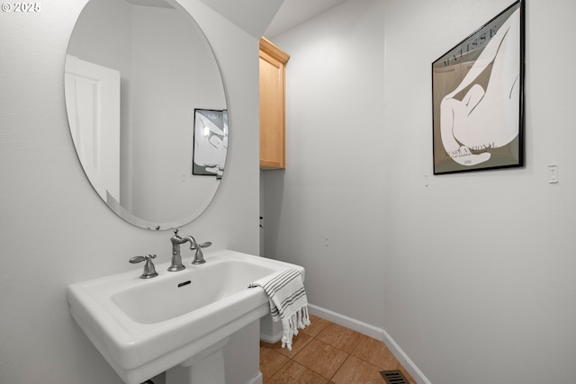 2834 SE Franklin St, Portland, OR 97202 - bathroom featuring a sink and tile patterned flooring