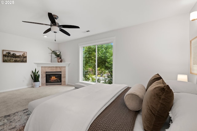 2834 SE Franklin St, Portland, OR 97202 - bedroom with a tiled fireplace, light colored carpet, and ceiling fan