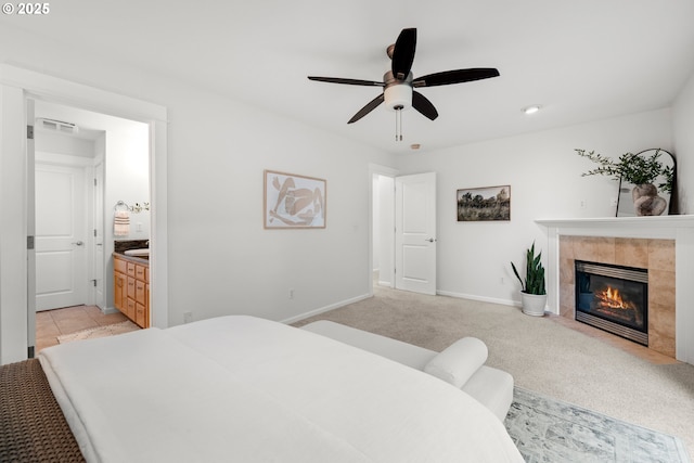 2834 SE Franklin St, Portland, OR 97202 - bedroom with a fireplace, light carpet, ensuite bathroom, a ceiling fan, and recessed lighting