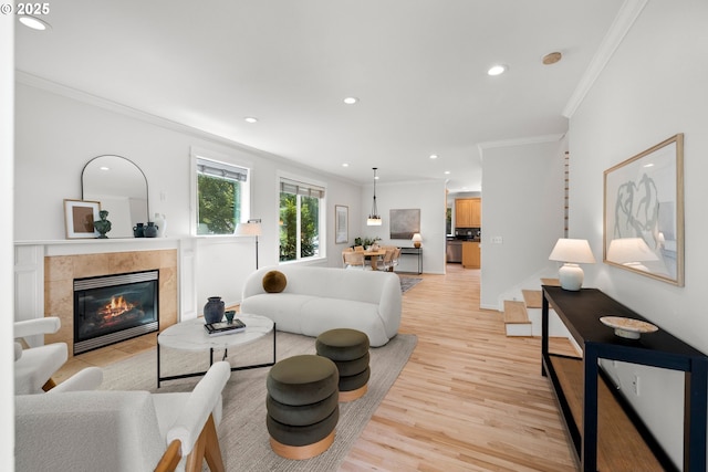 2834 SE Franklin St, Portland, OR 97202 - living area with ornamental molding, light wood-style floors, recessed lighting, and a fireplace